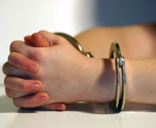 handcuffed individual