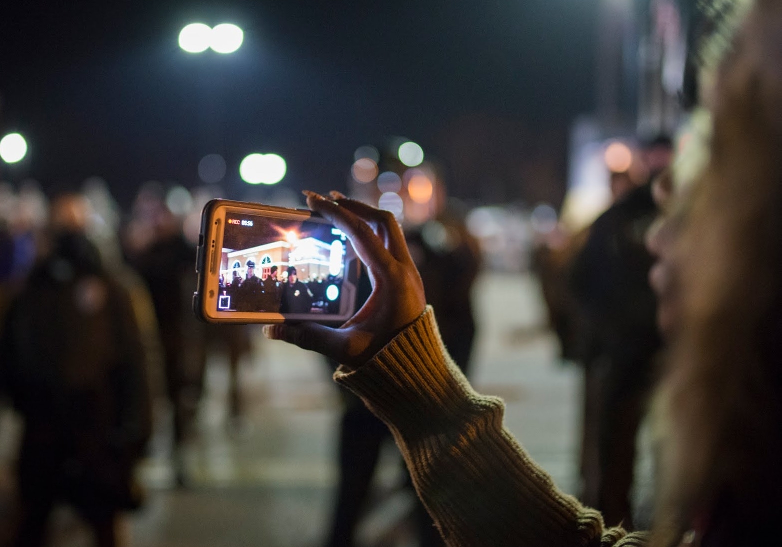 individual recording police with phone